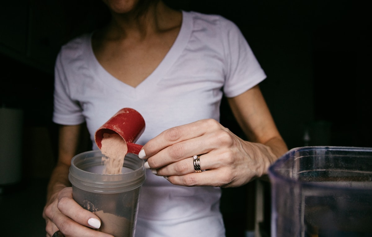 Lifter reviewing supplement label